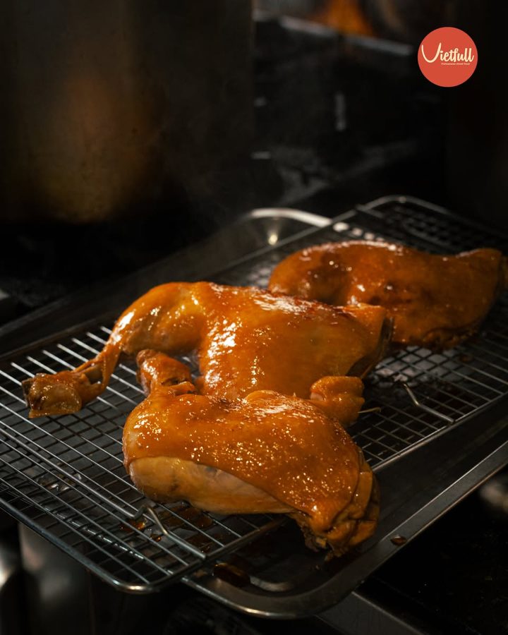 Glazed roast chicken resting on a rack